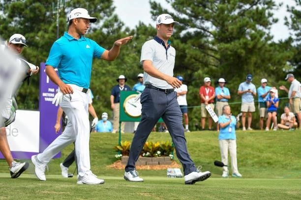 Xander Schauffele and Justin Thomas walk and talk during the second round of the World Golf Championships-FedEx St. Jude Invitational at TPC...