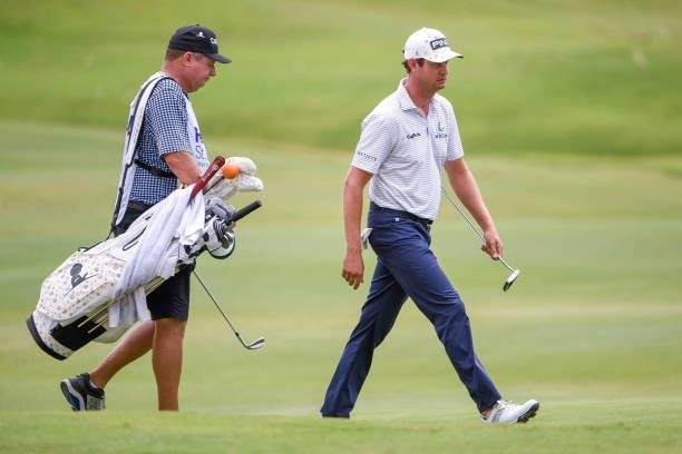 Harris English and caddie with a St. Jude Childrens Research Hospital golf bag walk down the 16th hole during the second round of the World Golf...