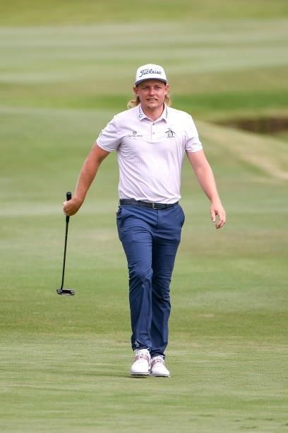 Cameron Smith of Australia twirls his putter as he walks up the 18th hole during the second round of the World Golf Championships-FedEx St. Jude...