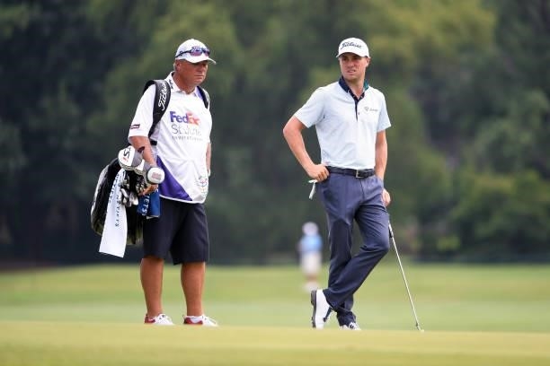 Justin Thomas with his caddie, Jimmy Johnson, on the 12th hole uring the second round of the World Golf Championships-FedEx St. Jude Invitational at...