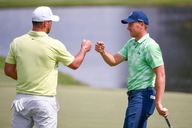 Jordan Spieth and Brooks Koepka at the 18th green during the second round of the World Golf Championships-FedEx St. Jude Invitational at TPC...