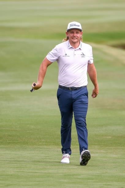 Cameron Smith of Australia twirls his putter as he walks up the 18th hole during the second round of the World Golf Championships-FedEx St. Jude...