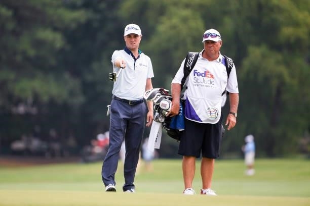 Justin Thomas with his caddie, Jimmy Johnson, on the 12th hole during the second round of the World Golf Championships-FedEx St. Jude Invitational at...