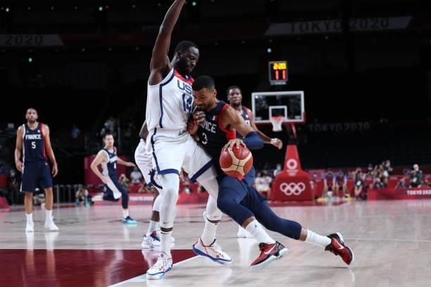 France's Timothe Luwawu Kongbo dribbles the ball past USA's Draymond Jamal Green in the men's final basketball match between France and USA during...