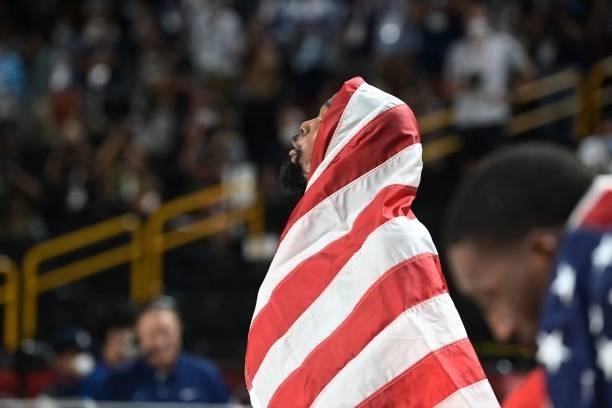 S Kevin Wayne Durant celebrates with the flag of the USA after their victory in the men's final basketball match between France and USA during the...