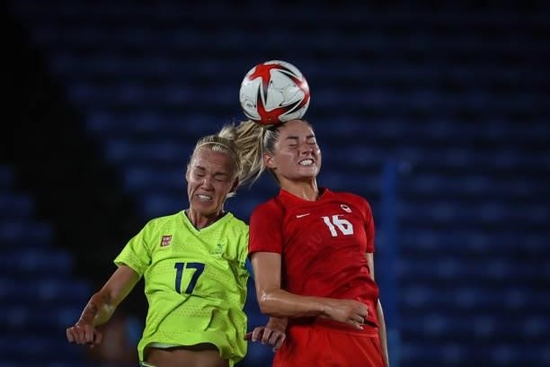 Caroline SEGER of Team Sweden competes for the ball with Janine BECKIE of Team Canada during the match between Sweden and Canada on day fourteenth of...
