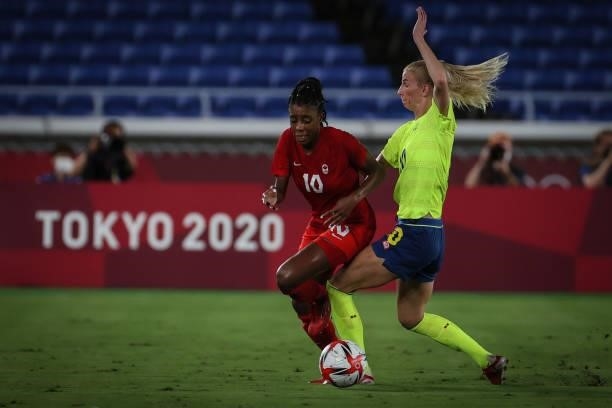 Sofia JAKOBSSON of Team Sweden competes for the ball with Ashley LAWRENCE of Team Canada during the match between Sweden and Canada on day fourteenth...