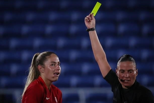 Referee Anastasia PUSTOVOITOVA yellow card to Janine BECKIE of Team Canada during the match between Sweden and Canada on day fourteenth of the Tokyo...