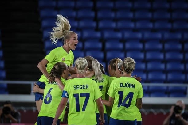 Players of Team Sweden celebrate after first goal during the match between Sweden and Canada on day fourteenth of the Tokyo 2020 Olympic Games at...