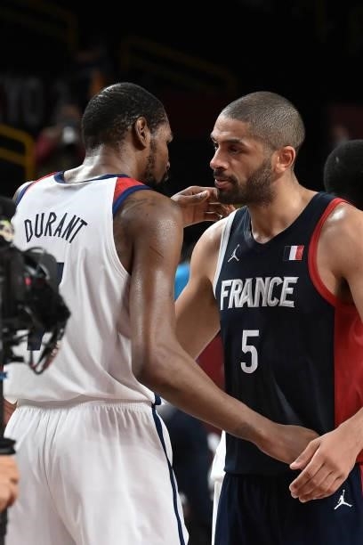 France's Nicolas Batum and USA's Kevin Wayne Durant talk after France's defeat in the men's final basketball match between France and USA during the...