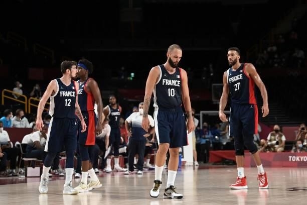 France's Nando De Colo , Evan Fournier and Rudy Gobert react after their defeat in the men's final basketball match between France and USA during the...