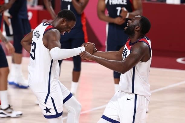 Bam Adebayo and Draymond Green of the USA Men's National Team celebrate after the game against the France Men's National Team during the Gold Medal...