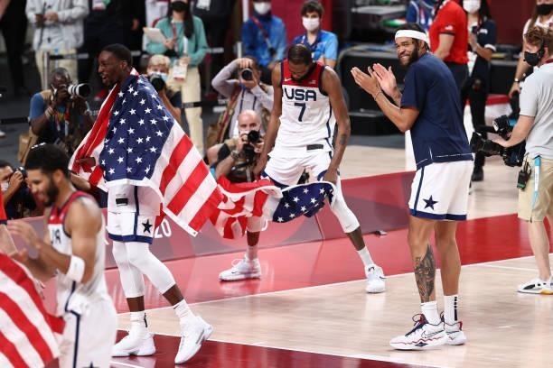 Bam Adebayo, Kevin Durant and JaVale McGee of the USA Men's National Team celebrate after the game against the France Men's National Team during the...