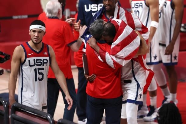 Kevin Durant of the USA Men's National Team hugs Assistant Coach Jay Wright after the game against the France Men's National Team during the Gold...