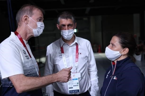 France's men's basketball team coach Vincent Collet speaks with French Junior Sports Minister Roxana Maracineanu after the men's final match between...