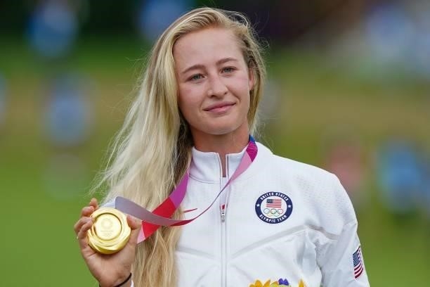 Gold medallist USA's Nelly Korda holds her medal on the podium during the victory ceremony of the womens golf individual stroke play during the Tokyo...