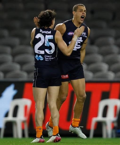Zac Fisher and Charlie Curnow of the Blues celebrate during the 2021 AFL Round 21 match between the Carlton Blues and the Gold Coast Suns at Marvel...