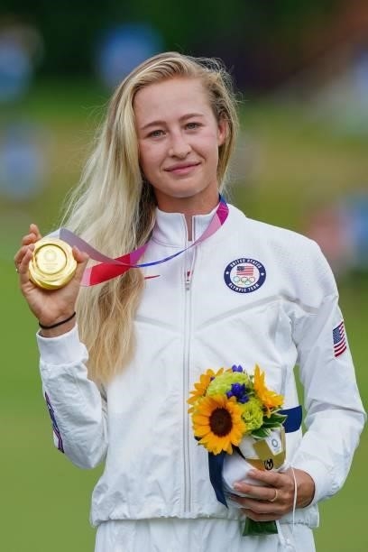 Gold medallist USA's Nelly Korda holds her medal on the podium during the victory ceremony of the womens golf individual stroke play during the Tokyo...