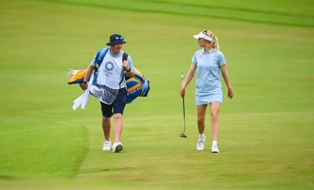 Saitama , Japan - 7 August 2021; Madelene Sagstrom of Sweden with her caddie Shane Codd on the 18th during round four of the women's individual...