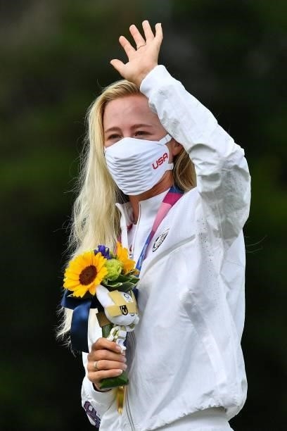Gold medallist USA's Nelly Korda stands on the podium during the victory ceremony of the womens golf individual stroke play during the Tokyo 2020...