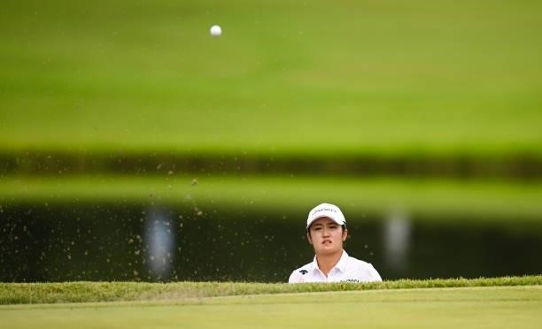 Saitama , Japan - 7 August 2021; Mone Inami of Japan plays from a bunker onto the 18th green during round four of the women's individual stroke play...