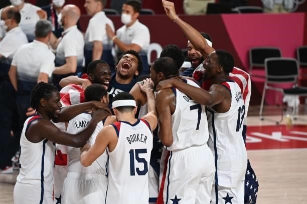 S players celebrate their victory in the men's final basketball match between France and USA during the Tokyo 2020 Olympic Games at the Saitama Super...