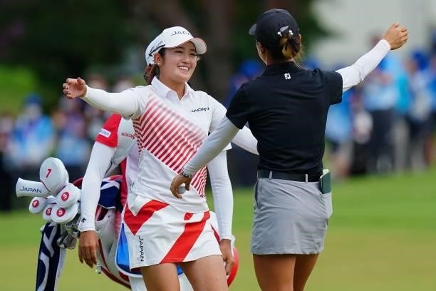 Silver medallist Japan's Mone Inami and bronze medallist New Zealand's Lydia Ko celebrate after the silver medal play-off of round 4 of the womens...