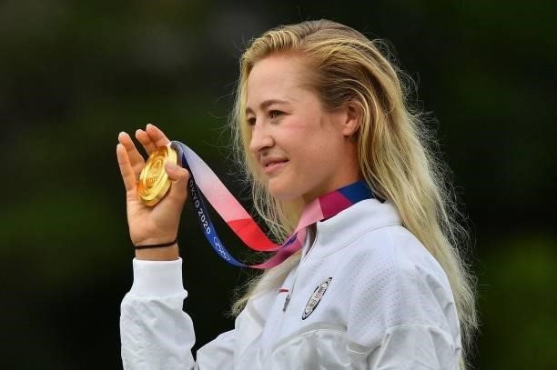 Gold medallist USA's Nelly Korda holds her medal on the podium in round 4 of the womens golf individual stroke play during the Tokyo 2020 Olympic...