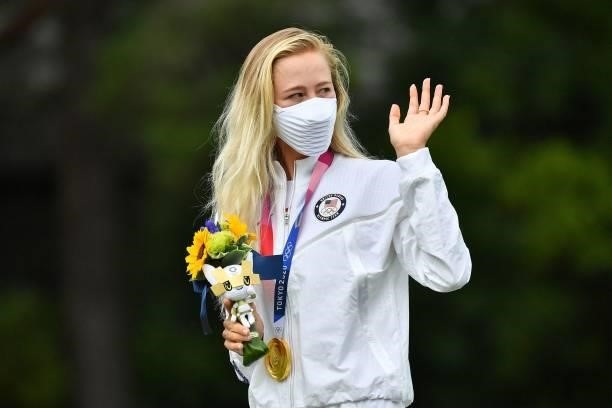 Gold medallist USA's Nelly Korda stands on the podium during the victory ceremony of the womens golf individual stroke play during the Tokyo 2020...