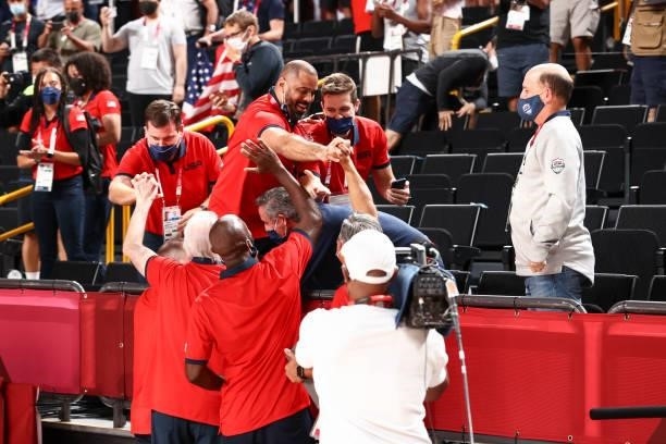 Coaching Assistant Ime Udoka high fives Assistant Coach Jay Wright of the USA Men's National Team and Assistant Coach Lloyd Pierce of the USA Men's...