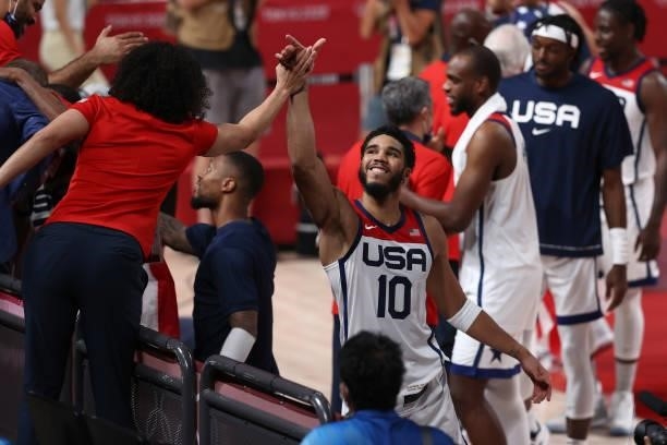 Jayson Tatum of the USA Men's National Team high-fives Head Coach Kara Lawson of the the USA Basketball Womens National 3x3 Team after the game...