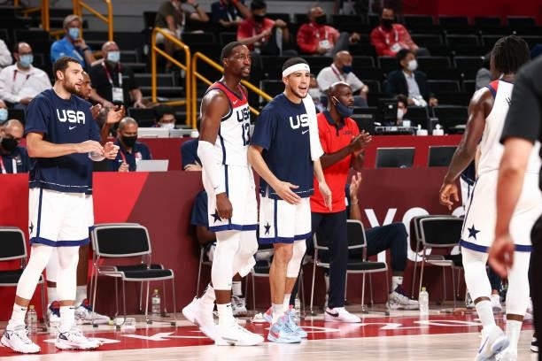 Bam Adebayo of the USA Men's National Team and Devin Booker of the USA Men's National Team react to a play during the Gold Medal Game of the 2020...