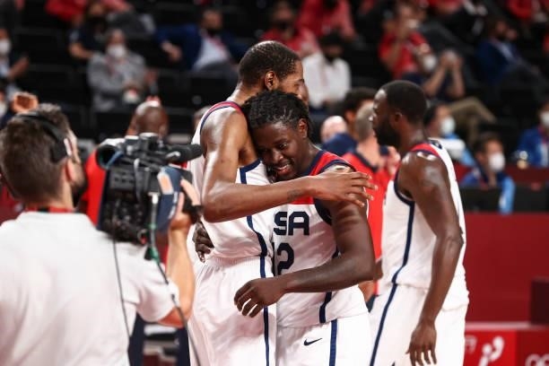 Kevin Durant of the USA Men's National Team hugs Jrue Holiday of the USA Men's National Team after defeating the France Men's National Team to win...