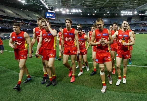 The Suns celebrate during the 2021 AFL Round 21 match between the Carlton Blues and the Gold Coast Suns at Marvel Stadium on August 7, 2021 in...