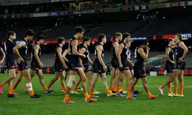 The Blues look dejected after a loss during the 2021 AFL Round 21 match between the Carlton Blues and the Gold Coast Suns at Marvel Stadium on August...