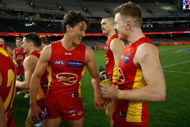 Wil Powell and Jacob Townsend of the Suns celebrate during the 2021 AFL Round 21 match between the Carlton Blues and the Gold Coast Suns at Marvel...