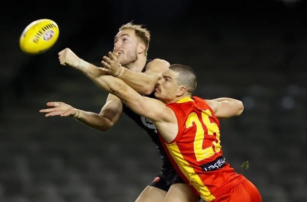 Harry McKay of the Blues and Sam Collins of the Suns compete for the ball during the 2021 AFL Round 21 match between the Carlton Blues and the Gold...