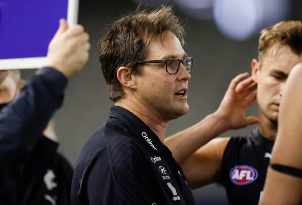 David Teague, Senior Coach of the Blues addresses his players during the 2021 AFL Round 21 match between the Carlton Blues and the Gold Coast Suns at...