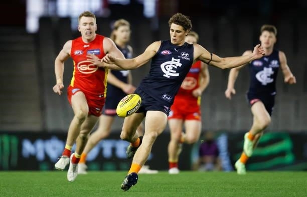 Charlie Curnow of the Blues kicks the ball during the 2021 AFL Round 21 match between the Carlton Blues and the Gold Coast Suns at Marvel Stadium on...