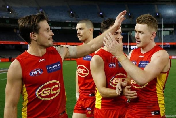 David Swallow of the Suns and Jacob Townsend celebrate during the 2021 AFL Round 21 match between the Carlton Blues and the Gold Coast Suns at Marvel...