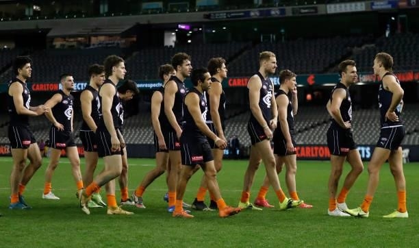 The Blues look dejected after a loss during the 2021 AFL Round 21 match between the Carlton Blues and the Gold Coast Suns at Marvel Stadium on August...