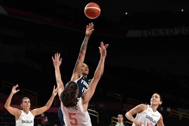France's Gabrielle Williams takes a shot past Serbia's Sonja Vasic in the women's bronze medal basketball match between Serbia and France during the...