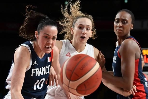 France's Sarah Michel and Serbia's Aleksandra Crvendakic fight for the ball in the women's bronze medal basketball match between Serbia and France...