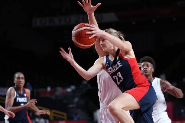 France's Marine Johannes passes the ball past Serbia's Yvonne Anderson in the women's bronze medal basketball match between Serbia and France during...
