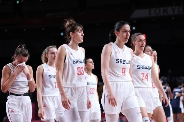 Serbian players walk off the court after losing the women's bronze medal basketball match between Serbia and France during the Tokyo 2020 Olympic...
