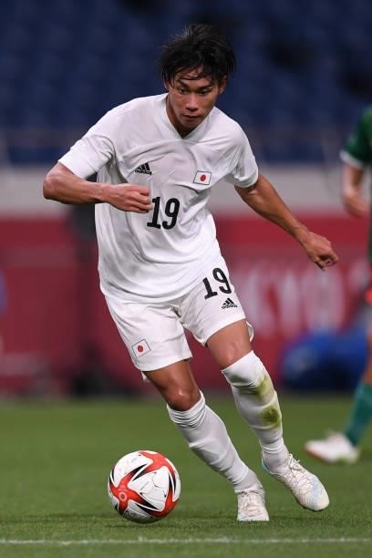 Daichi Hayashi of Japan dribbles the ball during the 3rd place match of the Men's Football between Mexico and Japan at Saitama Stadium on August 6,...