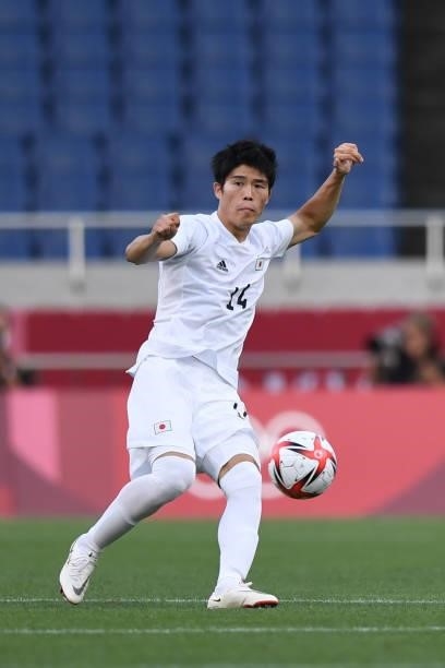 Takehiro Tomiyasu of Japan passes the ball during the 3rd place match of the Men's Football between Mexico and Japan on Day 14 of the Tokyo 2020...