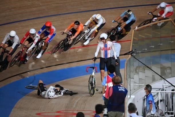 S Adrian Hegyvary and USA's Gavin Hoover react after crashed in the men's track cycling madison final during the Tokyo 2020 Olympic Games at Izu...