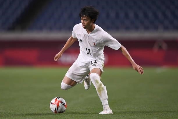Kaoru Mitoma of Japan dribbles the ball during the 3rd place match of the Men's Football between Mexico and Japan on Day 14 of the Tokyo 2020 Olympic...