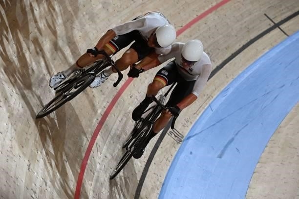 Germany's Roger Kluge and Germany's Theo Reinhardt in action in the men's track cycling madison final during the Tokyo 2020 Olympic Games at Izu...